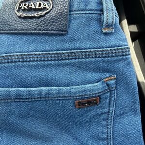 Size 8 preowned in great condition PRADA JEANS leather and metal patch RARE